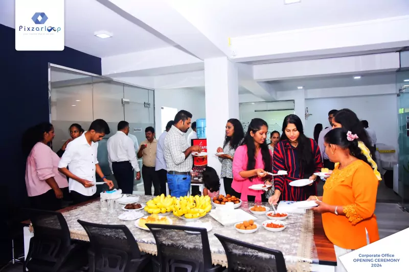 Guests sharing refreshments at the corporate office opening